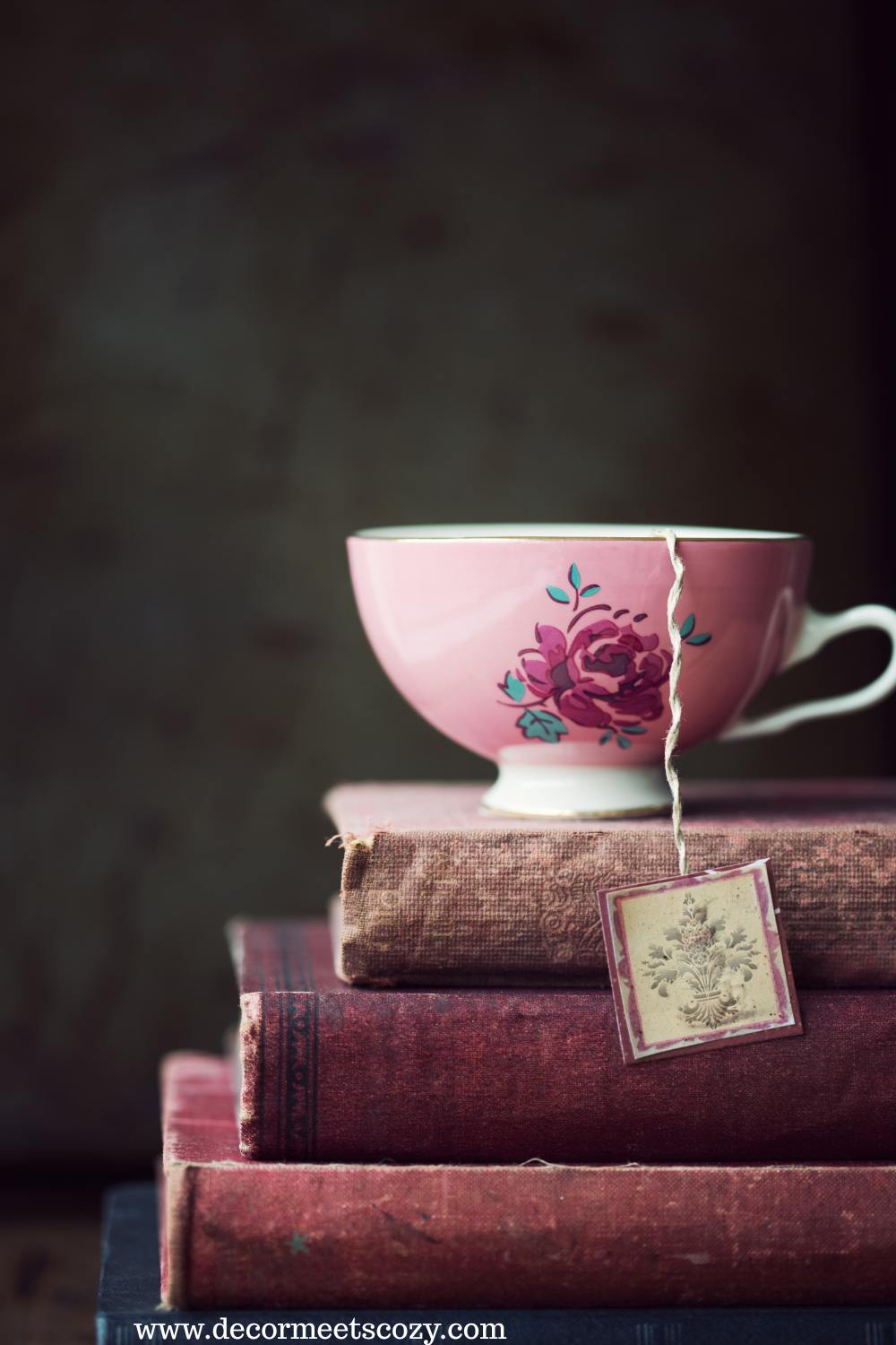 old books stacked on a table.